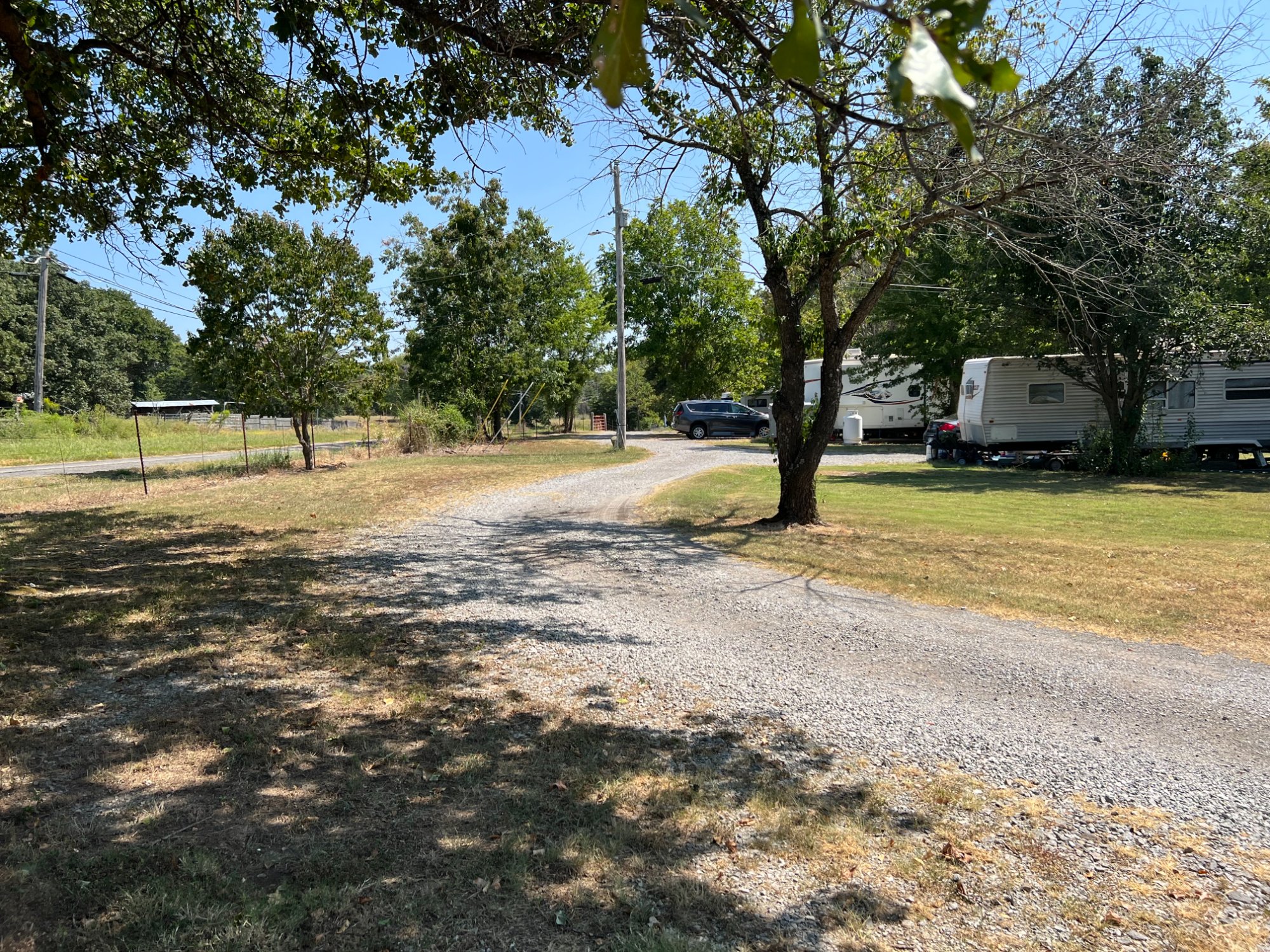 Gravel entrance road leading into Gibson RV Park